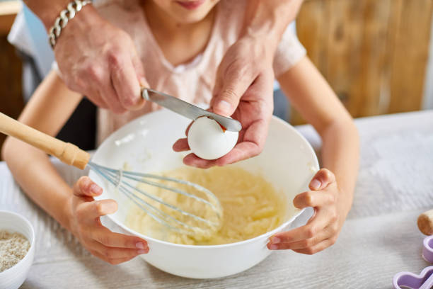 istock Father and daughter preparing dough together in kitchen 1277522698