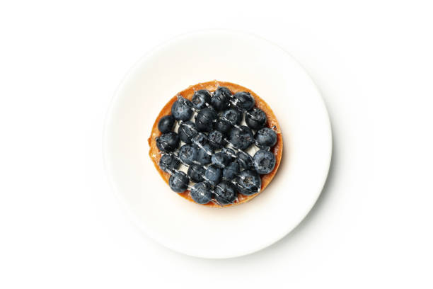 Plate with blueberry pie isolated on white background