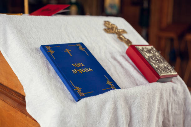 istock Prayer books and a crucifix on the table 1277527631