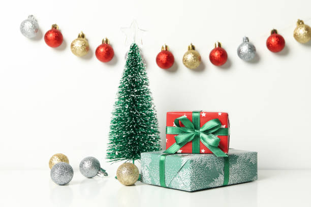istock Christmas trees, gifts and baubles on white background 1277527703