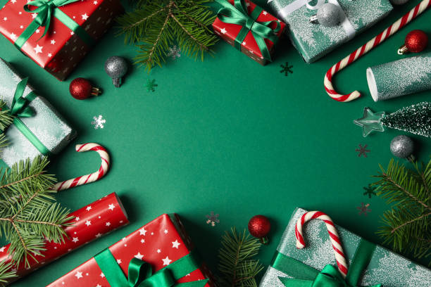 istock Different Christmas accessories on green background, top view 1277528067