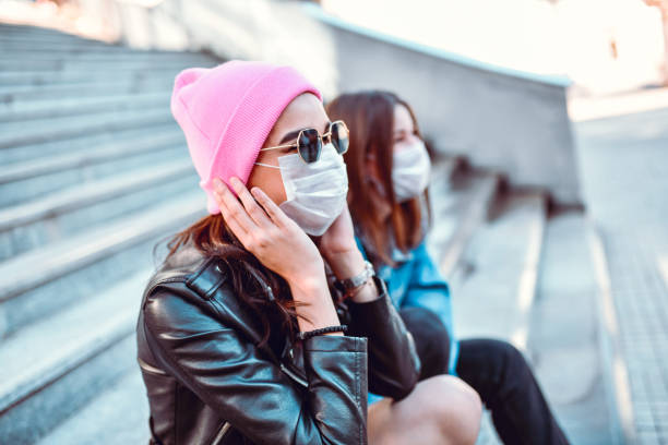istock Females Protected By Face Masks Spending Time Outside Together 1277528938