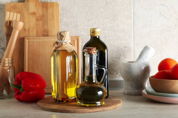 istock Kitchen table with different supplies and bottles with oil 1277529322