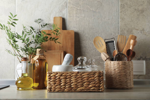 istock Kitchen table with different supplies and vase with plant 1277529528
