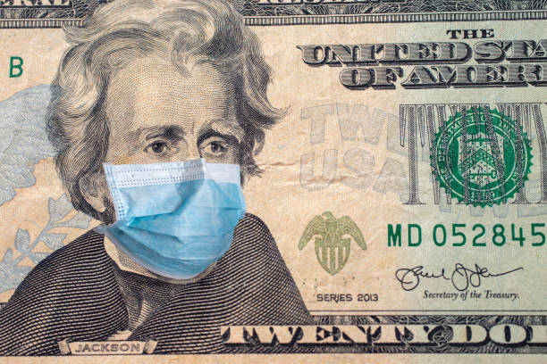 istock Twenty US dollars bill with face mask. Coronavirus covid outbreak concept 1277530119