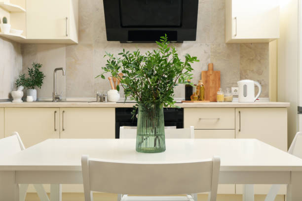 istock Kitchen interior with wooden table with vase with plant 1277530962