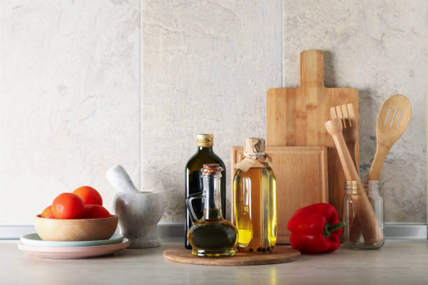 istock Kitchen table with different supplies and bottles with oil 1277530978