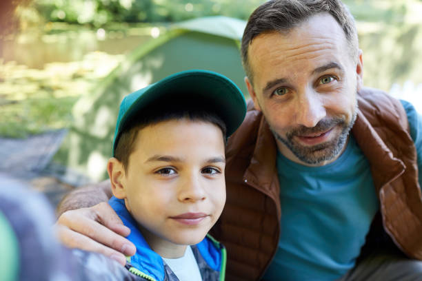 istock Father and Son Taking Selfie Outdoors 1277531106