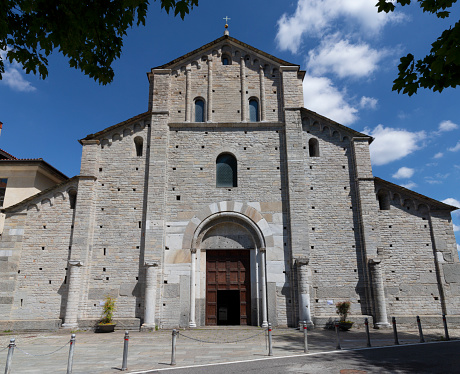 Como - The facede of romanesque church Basilica di San Abbondio.