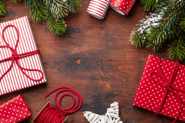 istock Christmas gift packaging, paper rools, decor and fir tree 1277532117