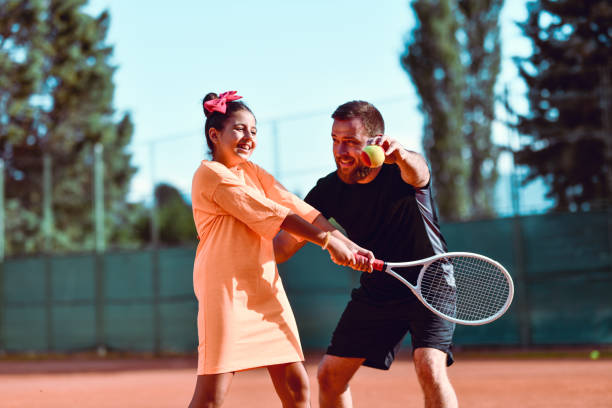 istock First Tennis Lessons For Smiling Female Child 1277532588