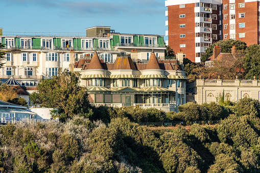 Bournemouth, UK. Saturday 26 September 2020. Turrets of the historic  Russell-Cotes Art Gallery & Museum building among other buildings in Bournemouth.