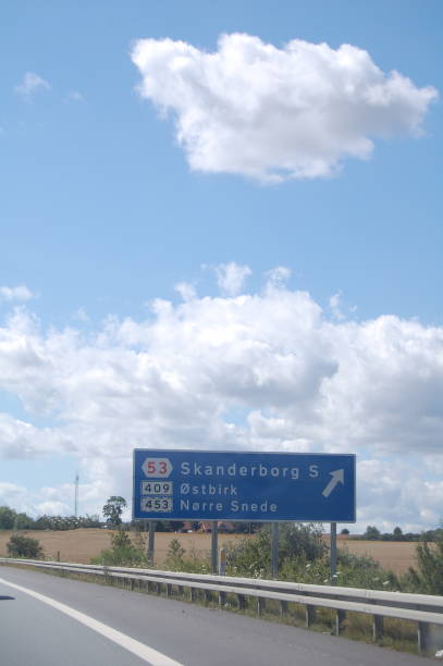 istock This exit- and information- sign stands in the highway side in Jutland showing that next exit is for 