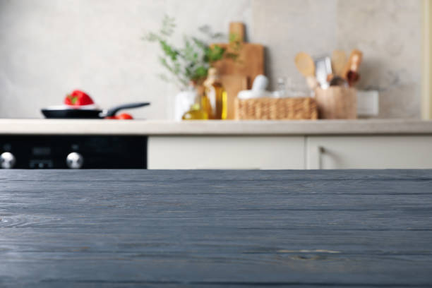 istock Wood table on blur kitchen room background 1277533725