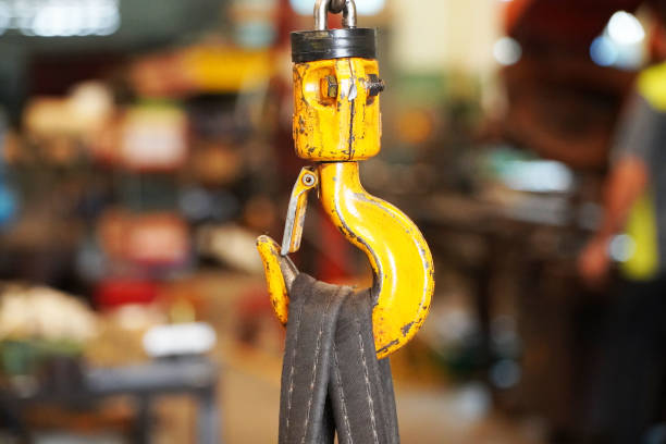 istock Hooks old rusty yellow cranes in an industrial plant 1277533742