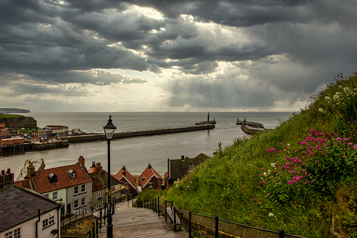 View of Whitby harbour on a stormy day. Famous view of a small fishing town