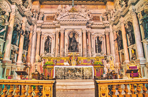 View of one altar in the Naples Cathedral or The Cathedral of the Assumption of Mary, (Italian: Duomo di Napoli, Cattedrale di Santa Maria Assunta or Cattedrale di San Gennaro; Neapolitan: Viscuvato 'e Napule) is a Roman Catholic cathedral, the main church of Naples, southern Italy, and the seat of the Archbishop of Naples. It is widely known as the Cattedrale di San Gennaro, in honour of Saint Januarius, the city's patron saint.. Naples, is the regional capital of Campania and the third-largest city of Italy, after Rome and Milan, with a population of almost 1million. It's the second-most populous metropolitan area in Italy and the 7th-most populous urban area in the European Union. In 1995, the historic center of Naples was listed by UNESCO as a World Heritage Site.