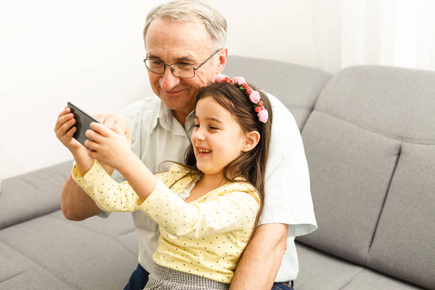 istock Grandfather and granddaughter make selfie 1277536898