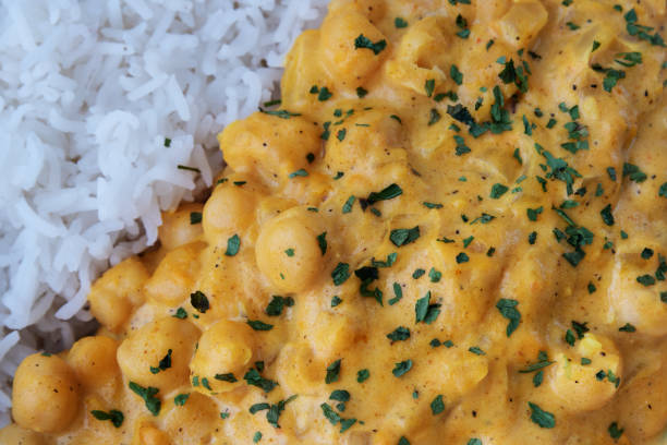 Chickpeas with curry accompanied by basmati rice