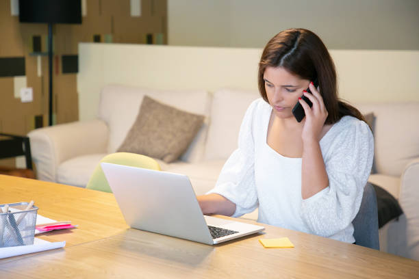 istock Serious female manager discussing project with customer 1277540242