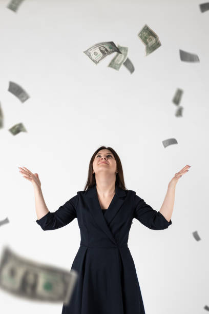 istock Rejoicing. Woman in blue and dollars. 1277546104