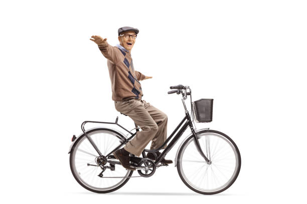 istock Happy elderly man riding a bicycle and spreading arms 1277546948