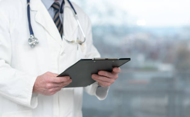 istock Doctor holding a clipboard 1277548660