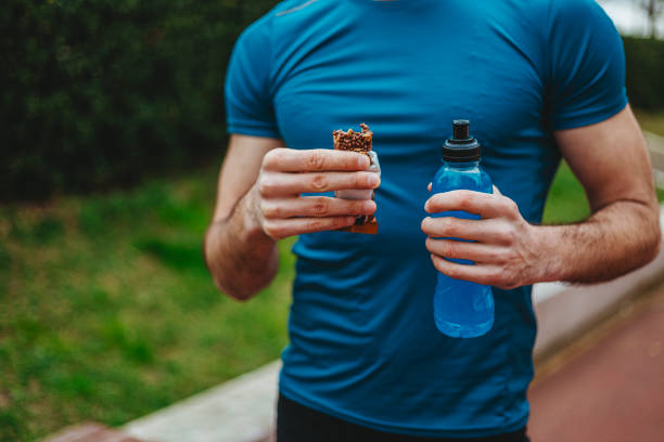istock Man eating energy bar 1277550391