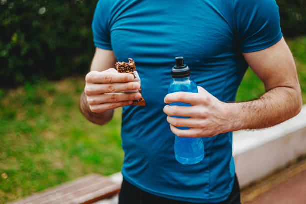 istock Man eating energy bar 1277550433