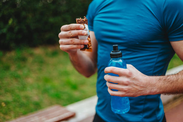 istock Man eating energy bar 1277550487