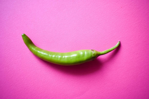 Hot chili peppers on bright background