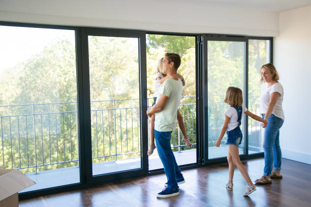 istock Happy father with daughter standing near open balcony 1277554084