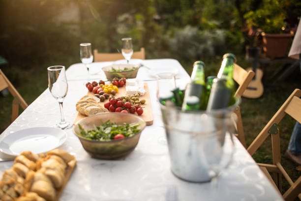 istock Dining table with appetizers for birthday party at backyard 1277558088