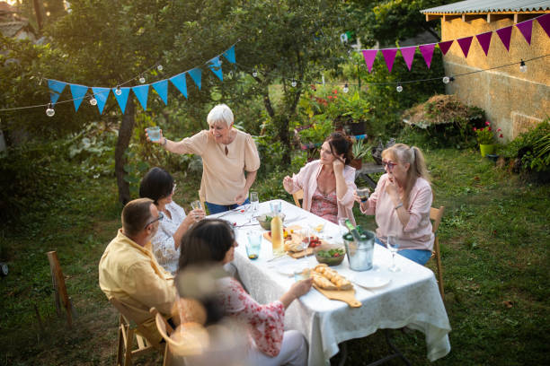 istock Old friends having fun time on birthday party at backyard 1277558336
