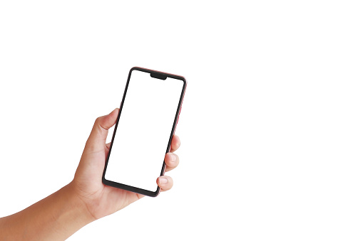 La mano está sosteniendo la pantalla blanca, el teléfono móvil está aislado sobre un fondo blanco con la ruta de recorte. photo