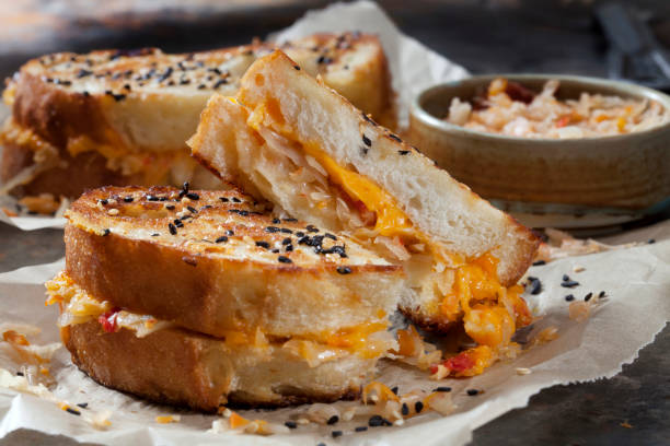 Spicy Korean Kimchi Grilled Cheese Sandwich's Spicy Korean Kimchi Grilled Cheese Sandwich's on Sourdough Bread with Sesame Seeds toasted sandwich stock pictures, royalty-free photos & images