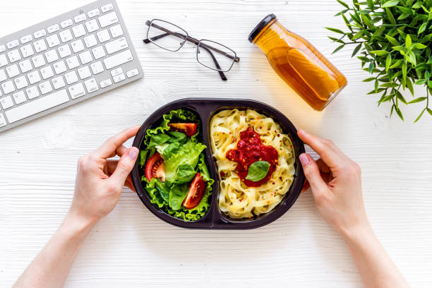 istock Lunch at workplace. Delivery boxes with meal, top view 1277563640