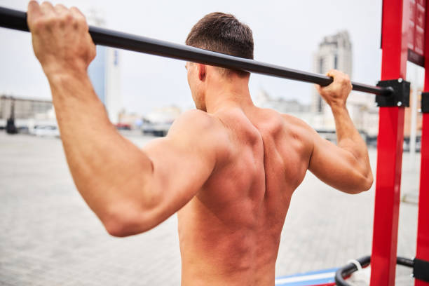istock Shapely young male training upper body in open air 1277564745