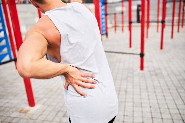 istock Muscular man got sprain during workout outdoors 1277565097