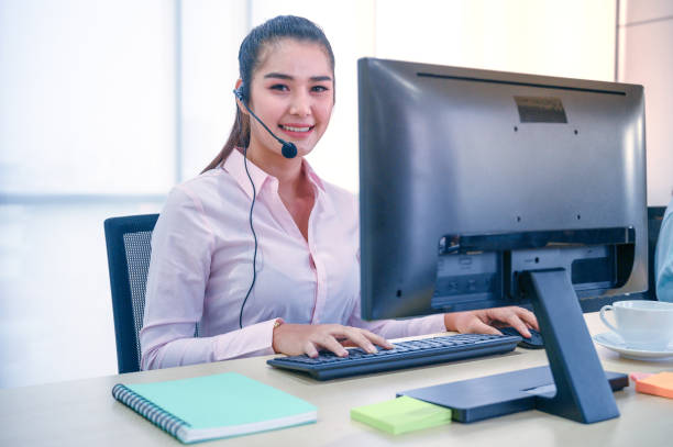istock Young customer service women agent with headsets and computer working at office. 1277566701