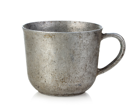 Antique iron cup isolated on white background.
