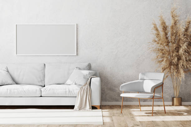 istock Blank white horizontal frame mock up in Light coloured minimalistic living room interior with white and gold sofa and armchair with decorative plaster wall and wooden parquet floor, 3d render 1277567871