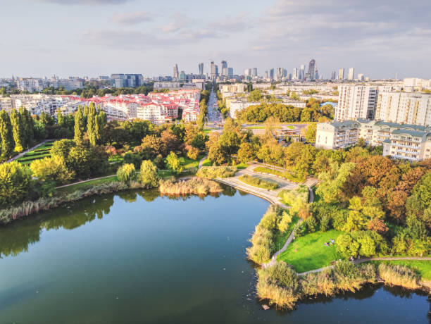 Park with large lake in the big, capital city. Drone, aerial view stock photo