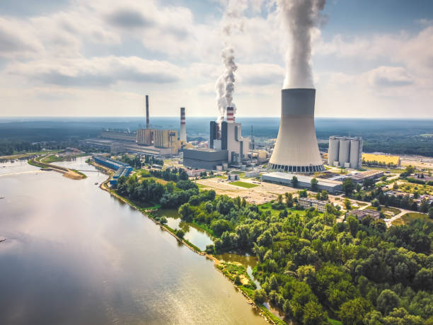 Large power station with steam coming from cooling tower. Drone, aerial view stock photo