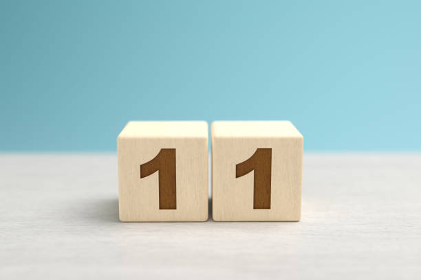Wooden toy blocks forming the number 11. Wooden toy blocks forming the number 11. number 11 stock pictures, royalty-free photos & images