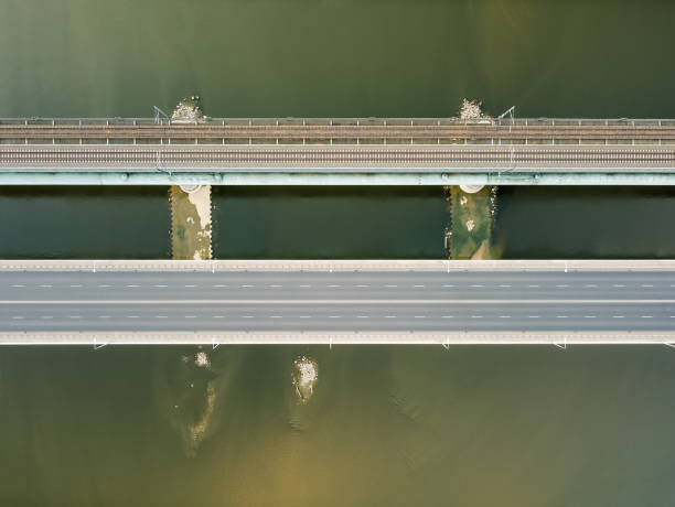 istock Top down view on a car and train bridge. Drone, aerial view. 1277568429