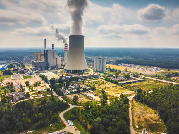 Large power station with steam coming from cooling tower. Drone, aerial view stock photo