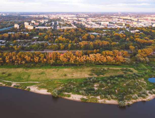 istock Meadown over a river in a city. Drone, aerial view 1277568701