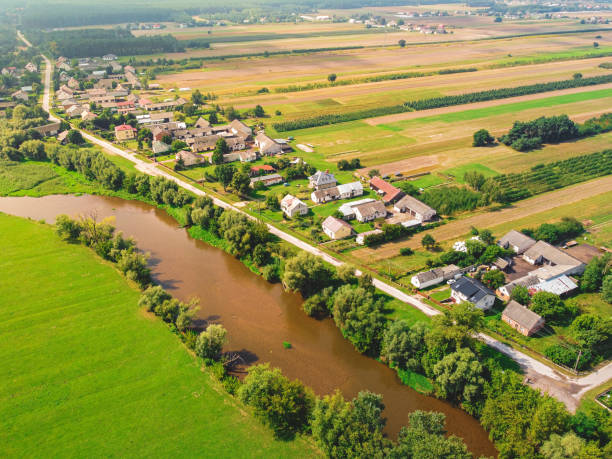 Small village over a small river. Drone, aerial view. Drone, aerial view stock photo