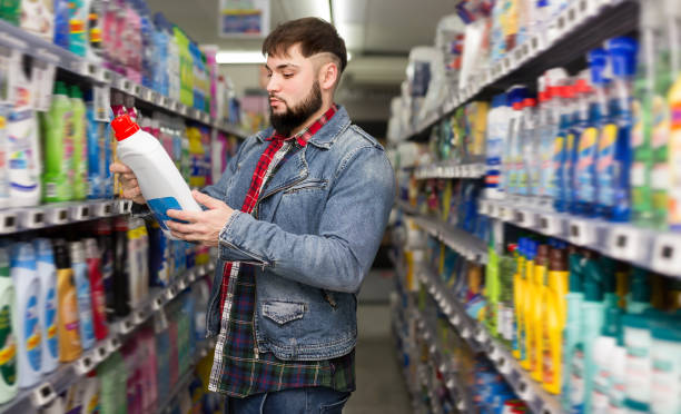 istock Interested young man making purchases in store 1277569661